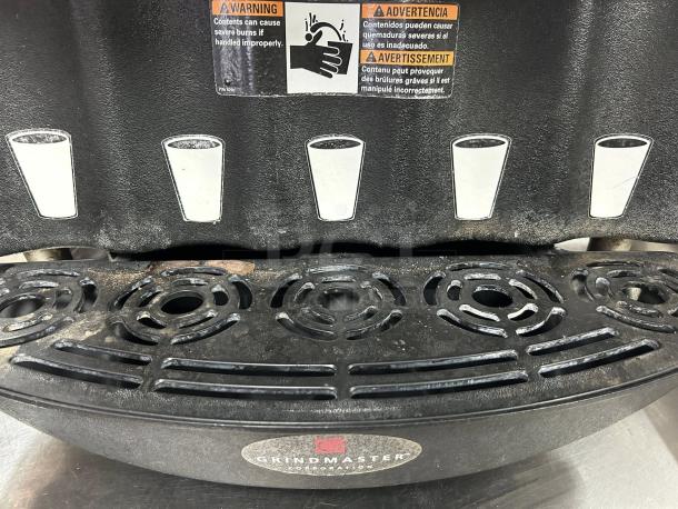 Grindmaster PIC5 beverage dispenser, five-flavor, excellent condition, tested and working, warning labels visible.