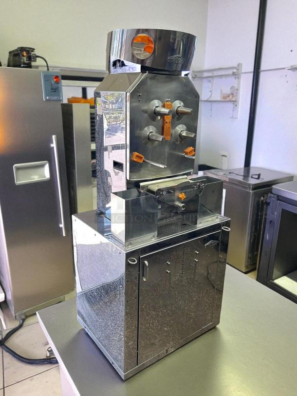 Citrocasa 8000 SB-ATS citrus juicer, stainless steel, fair condition, visible signage and orange components, "As Is".