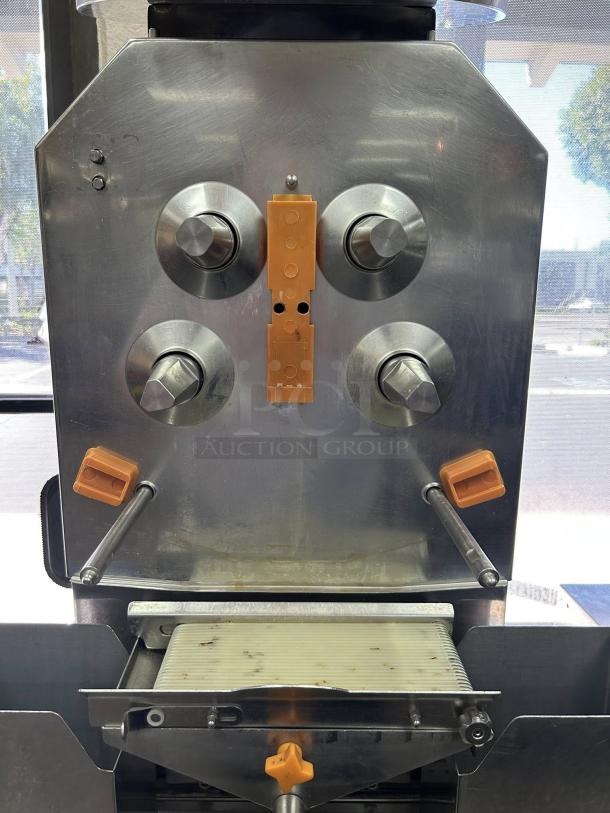 Citrocasa 8000 SB-ATS Advance Citrus Juicer, stainless steel, visible wear, orange handles, “As Is” condition.