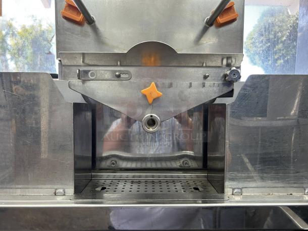 Citrocasa 8000 SB-ATS Advance Citrus Juicer, stainless steel, visible wear, orange accents, as-is condition.