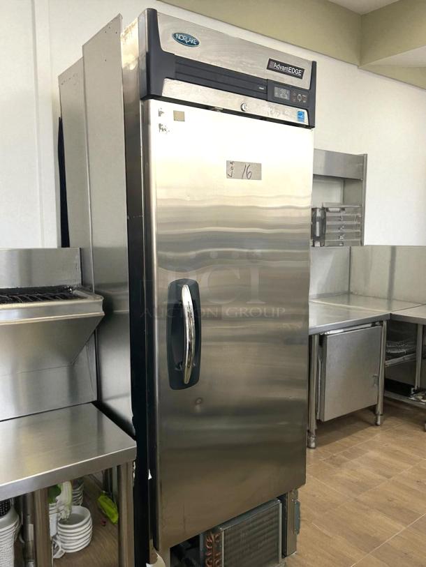 Norlake NLF23-S AdvantEDGE 28" Reach-In Freezer, 23 Cu. Ft., solid door, excellent condition, displayed in a kitchen setting.