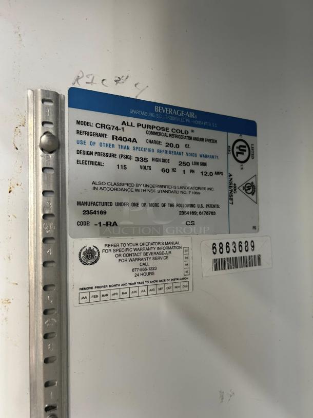 Beverage Air CRG74-1 3-door refrigerator label showing model details, refrigerant type R404A, and warranty information.