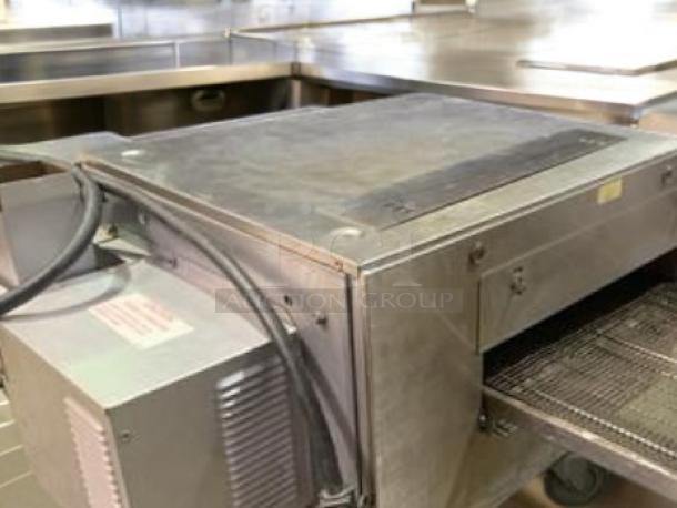 Lincoln 1301-11 electric conveyor pizza oven in outstanding condition, 208V, fully tested, stainless steel exterior.