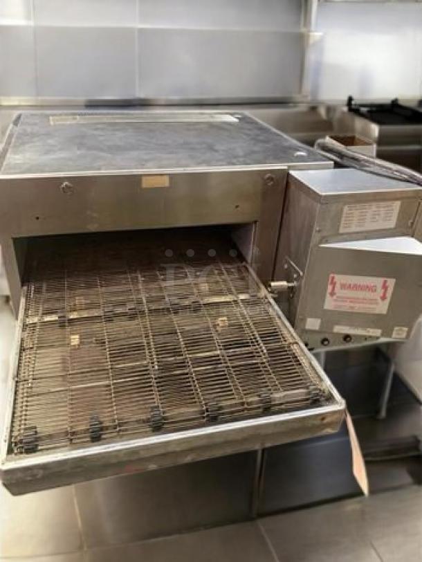 Lincoln Impinger Model 1301-11 electric conveyor pizza oven, outstanding condition, 208V, fully tested, stainless steel.