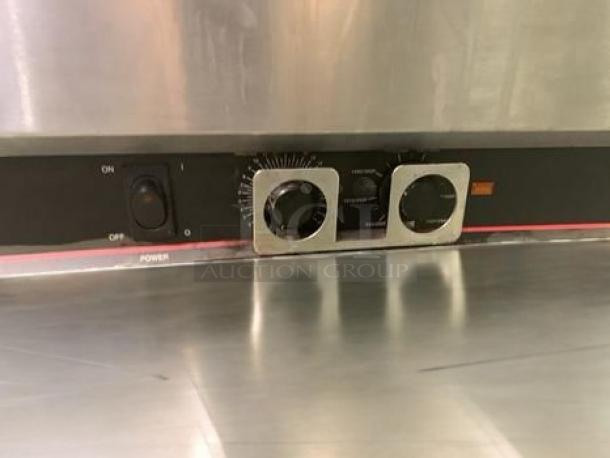 Lincoln Impinger 1301-11 electric conveyor pizza oven in outstanding condition; features power switch and dial controls.