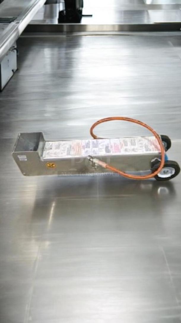 Frymaster Portable Shortening Disposal Shuttle in great condition, tested and working, with visible labels and sturdy wheels.