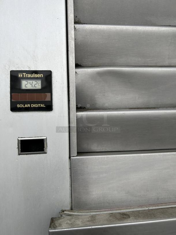 Traulsen G12010 freezer, right-hinged door, tested working, solar digital display reading 24.2°C, stainless steel finish.