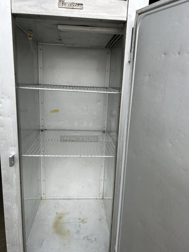 Traulsen G12010 30" single door reach-in freezer, right hinged, good condition, tested, two adjustable shelves.