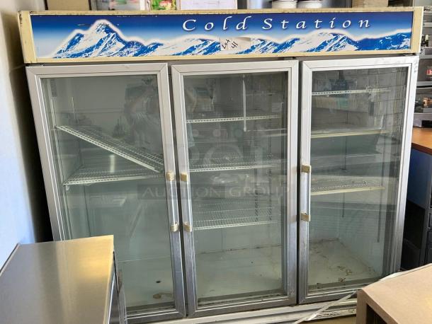 Blue Air BAGR72 3 Door Merchandising Refrigerator in excellent condition. Features glass doors, shelving, and "Cold Station" signage.