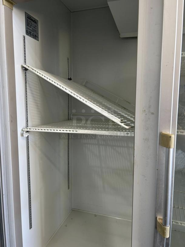 Blue Air BAGR72 3 Door Merchandising Refrigerator, excellent condition, interior view with adjustable shelves.