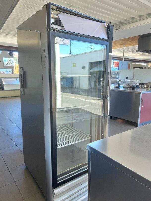Everest EMGR24 single swing glass door refrigerator, tested and working, visible wear, clear glass, and spacious interior.