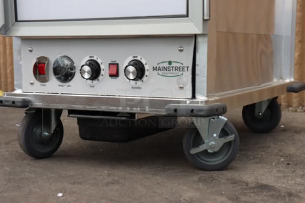 MainStreet Equipment CHP-1836U full-size heated cabinet, clear door, control panel, new condition, wheeled base.