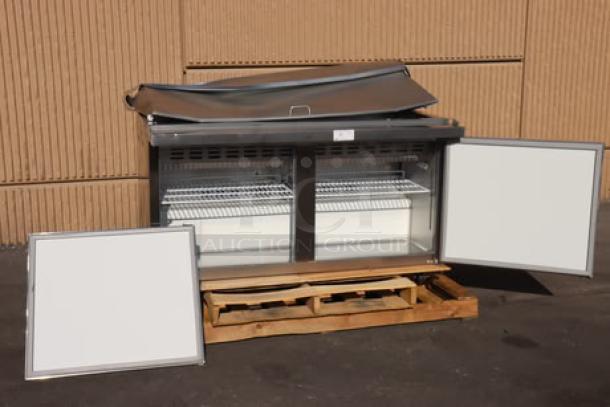 Brand new Avantco APT-60M-HC 60" refrigerated sandwich prep table, 2-door, 115V, 540W, on a pallet, open doors.