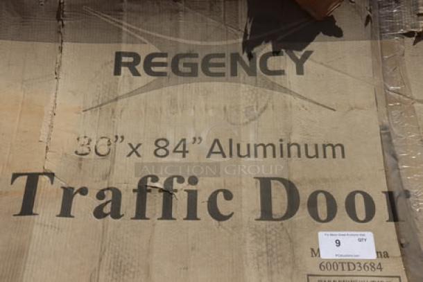 BRAND NEW SCRATCH-N-DENT Regency aluminum swinging traffic door, model 600TD3684, 36" x 84", 9" x 14" window, out of packaging.
