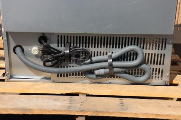 Avantco Ice UC-H-280-A undercounter ice machine rear view, power cord attached, missing front cover, new condition.