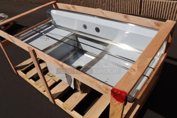 Regency 600S12323224 stainless steel two-compartment sink with galvanized legs, 23"x23"x12" bowls, two drainboards, new but possibly scratched.