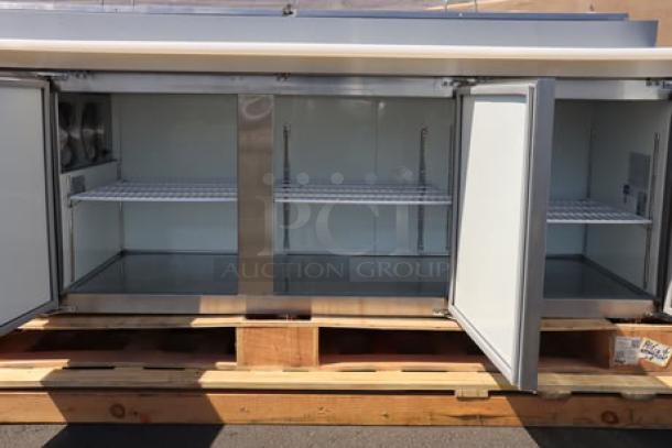 Brand new Avantco APPT-91-HC 92" 3-door refrigerated pizza prep table, stainless steel, includes shelving, on pallet, 115V.