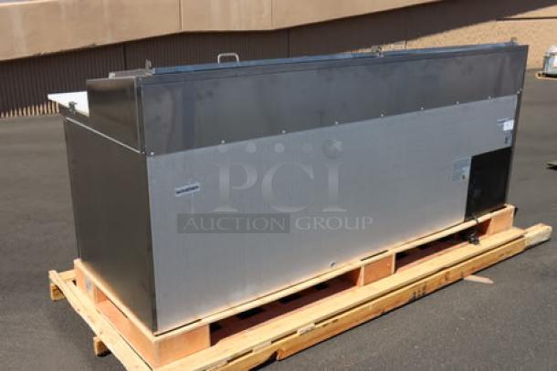 Brand new Avantco APPT-91-HC 92" 3-door refrigerated pizza prep table on pallet, showing stainless steel body, minor visible dents.