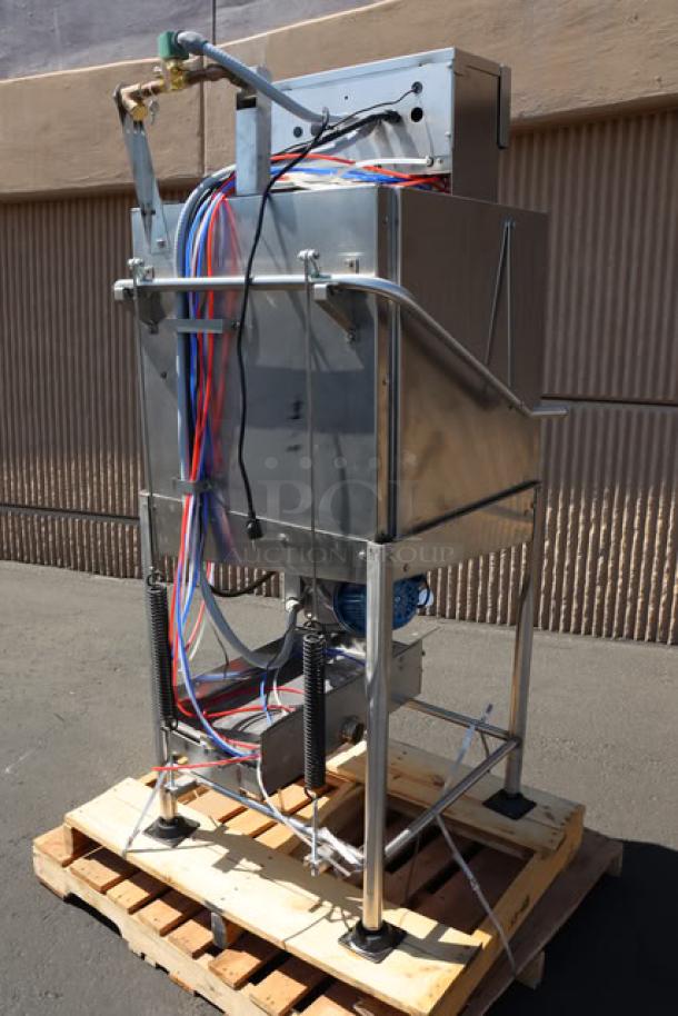 Noble Warewashing I-E door-type dish machine, model 495NOWF1EX, in used condition on wooden pallet.