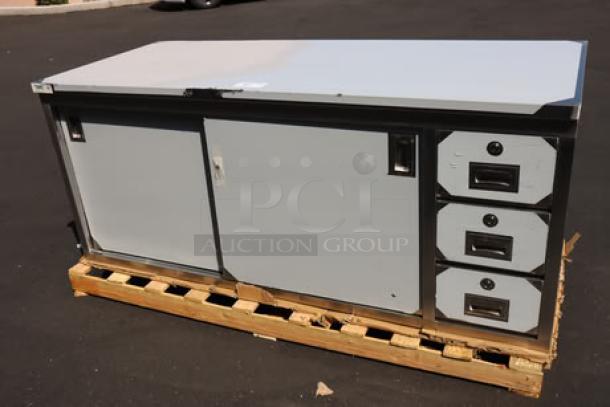 Brand new Regency 600EBT3072R 30"x72" stainless steel enclosed base sliding door table with drawers, on pallet.