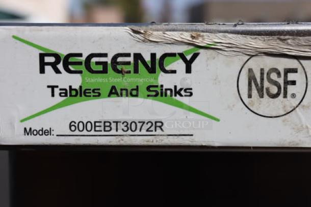 BRAND NEW SCRATCH-N-DENT Regency 600EBT3072R stainless steel table label with model number, visible wear marks.