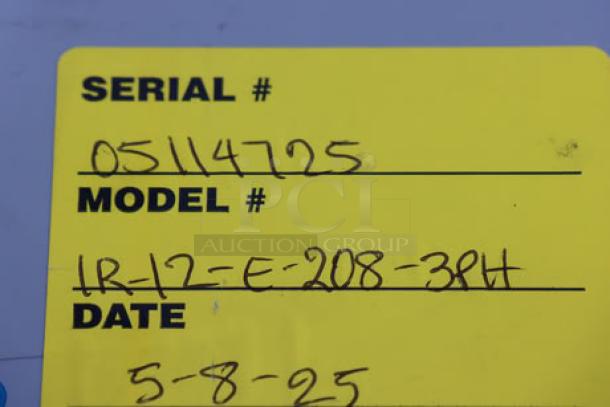 Yellow label with serial number 05114725, model IR-12-E-208-3PH, dated 5-8-25.