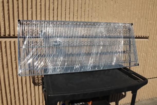 Regency 24" x 60" NSF Chrome Wire Shelf, Model 460EC2460, wrapped in plastic, brand new, minor scratching and denting.