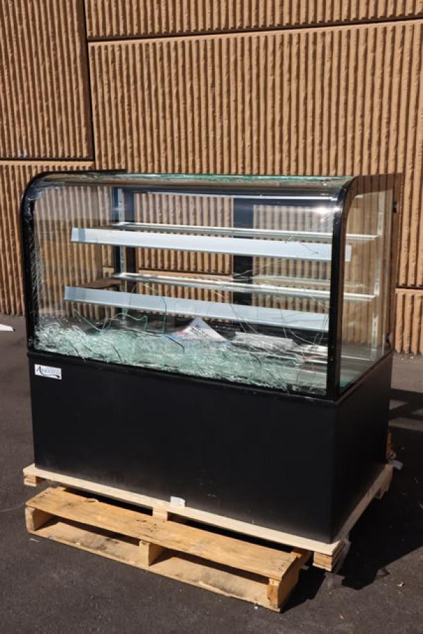 Avantco BC-48-HC 48" curved glass black refrigerated bakery display case on pallet; glass is broken; tested and working.
