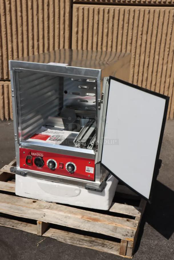 Brand new Avantco HPI-1812 heated holding cabinet with clear door, label visible, 120V, 1,575W, on pallet.