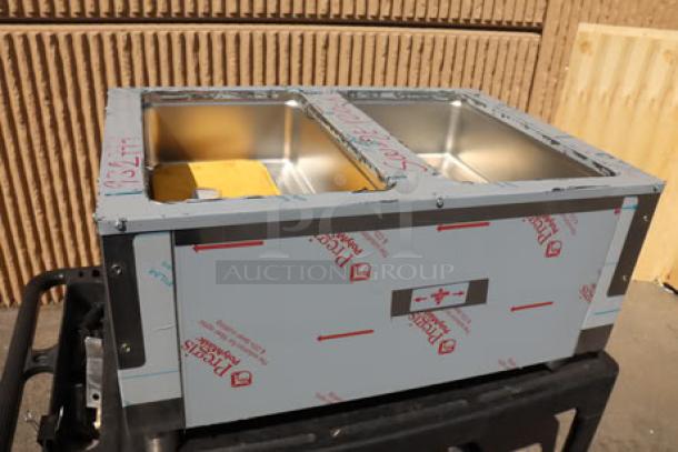 Brand new Advance Tabco SW-2E-120 electric hot food table, sealed wells, 120V, with undershelf. Model shown with protective covering.