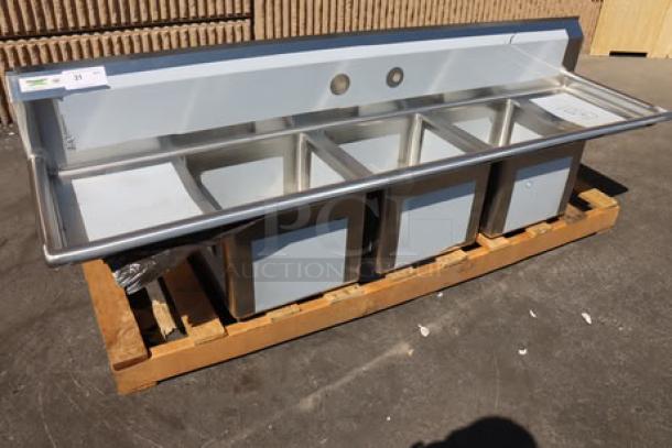 Regency 79" stainless steel three-compartment sink, model 600S31515215. Factory wrapped, galvanized legs, minor scratches.