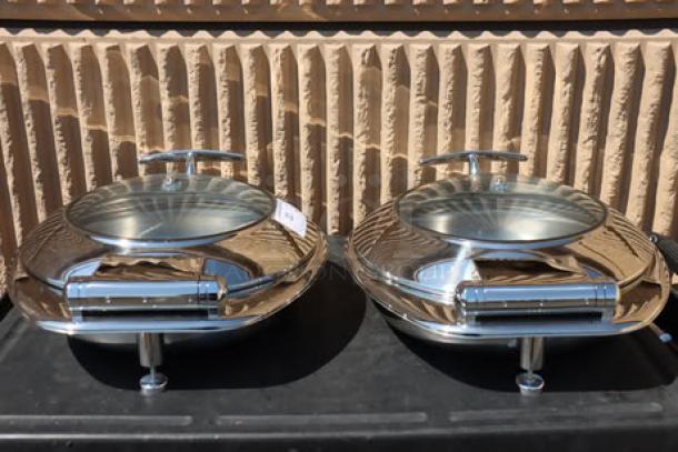 Brand new Acopa Voyage 6 Qt. round stainless steel induction chafers, model 407IND6CHAF, with glass top, soft-close lid.