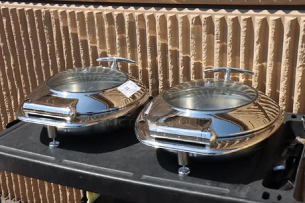Acopa Voyage 6 Qt. round stainless steel induction chafers with glass tops and soft-close lids, model 407IND6CHAF, new condition, out of packaging.