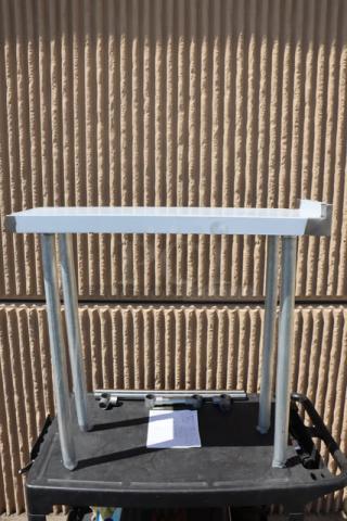 Regency 600WT12X36BS 36"x12" stainless steel filler table with backsplash, minor scratches, packaging damaged.
