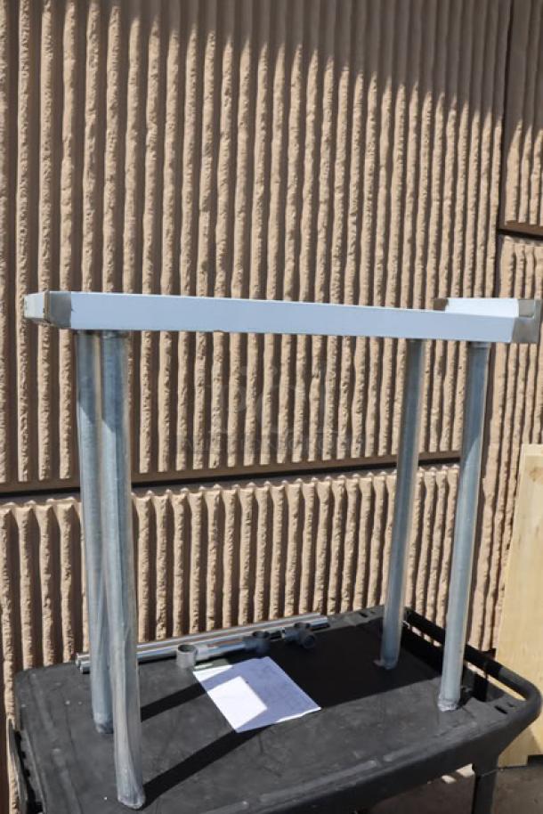 Regency 600WT12X36BS 36"x12" stainless steel filler table with backsplash. New, minor scratches, damaged packaging.