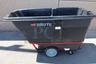 Rubbermaid BRUTE FG131600BLA black tilt truck, 1.0 cubic yard, 2100 lb capacity, on wheels, serial number 400011228378.
