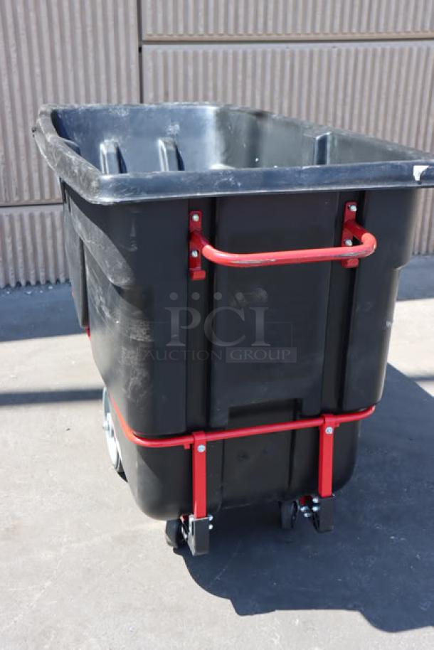 Rubbermaid FG131600BLA BRUTE tilt truck, 1.0 cubic yard, 2100 lb. capacity, black with red handles, used condition.