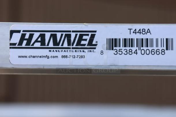 Aluminum cafeteria tray rack, Channel T448A model, 20 trays, new condition with bent middle bar. Channel label visible.