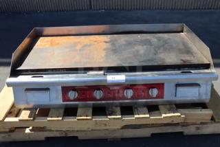 Brand new Avantco EG48N 48" electric countertop griddle with visible scratches. Model EG48N, 208/240V, 10482W-14000W.