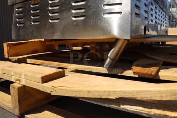 Brand new Avantco EG48N 48" electric griddle, scratch-and-dent condition, on a pallet. Model EG48N, 208/240V, 10482W-14000W.