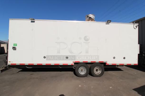 NEW Cruising Kitchens 24' food trailer, white exterior, equipped with security cameras, AC units, LED lights, and propane setup.