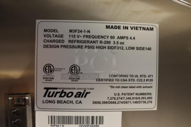 NEW Cruising Kitchens 24' food trailer label for Turbo Air model M3F24-1-N. Lists voltage, refrigerant, and certifications.