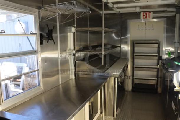 24' Cruising Kitchens food trailer, new condition, stainless steel interior, wireless cameras, rooftop A/C, propane and water hookups.