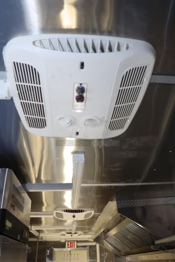 NEW 24' Cruising Kitchens food trailer, stainless steel interior with rooftop AC units, never-used equipment.