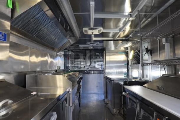 NEW Cruising Kitchens 24' food trailer, stainless interior, new equipment, security cameras, AC units, propane tanks, LED lights.