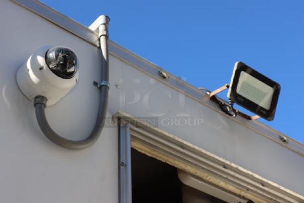 New Cruising Kitchens 24' Enterprise food trailer, wireless security camera, LED flood light, white exterior, new condition.