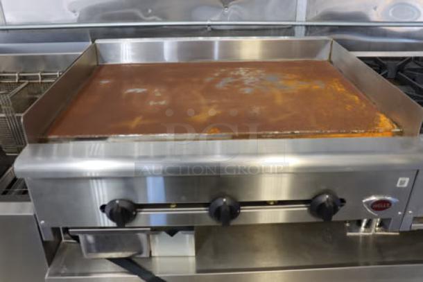 Brand new Cruising Kitchens 24' Enterprise food trailer with stainless steel interior and top-of-the-line equipment.