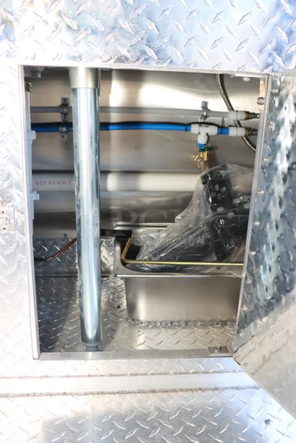 NEW Cruising Kitchens 24' food trailer, stainless interior, water and propane hookups, diamond plate detailing.