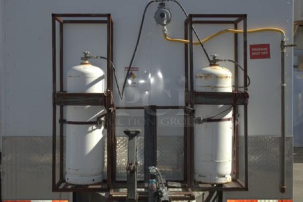 NEW Cruising Kitchens 24' food trailer with propane tanks, security cameras, A/C units, LED lights, and hookups visible.