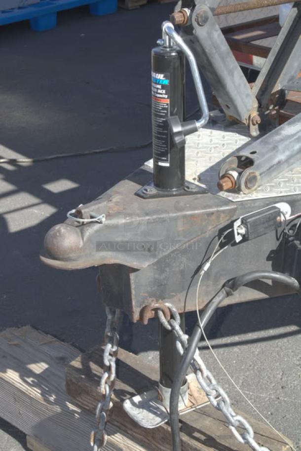 Cruising Kitchens 24' Enterprise Food Trailer with ball hitch, jack stand, and electrical hook-up, part of high-end equipment.